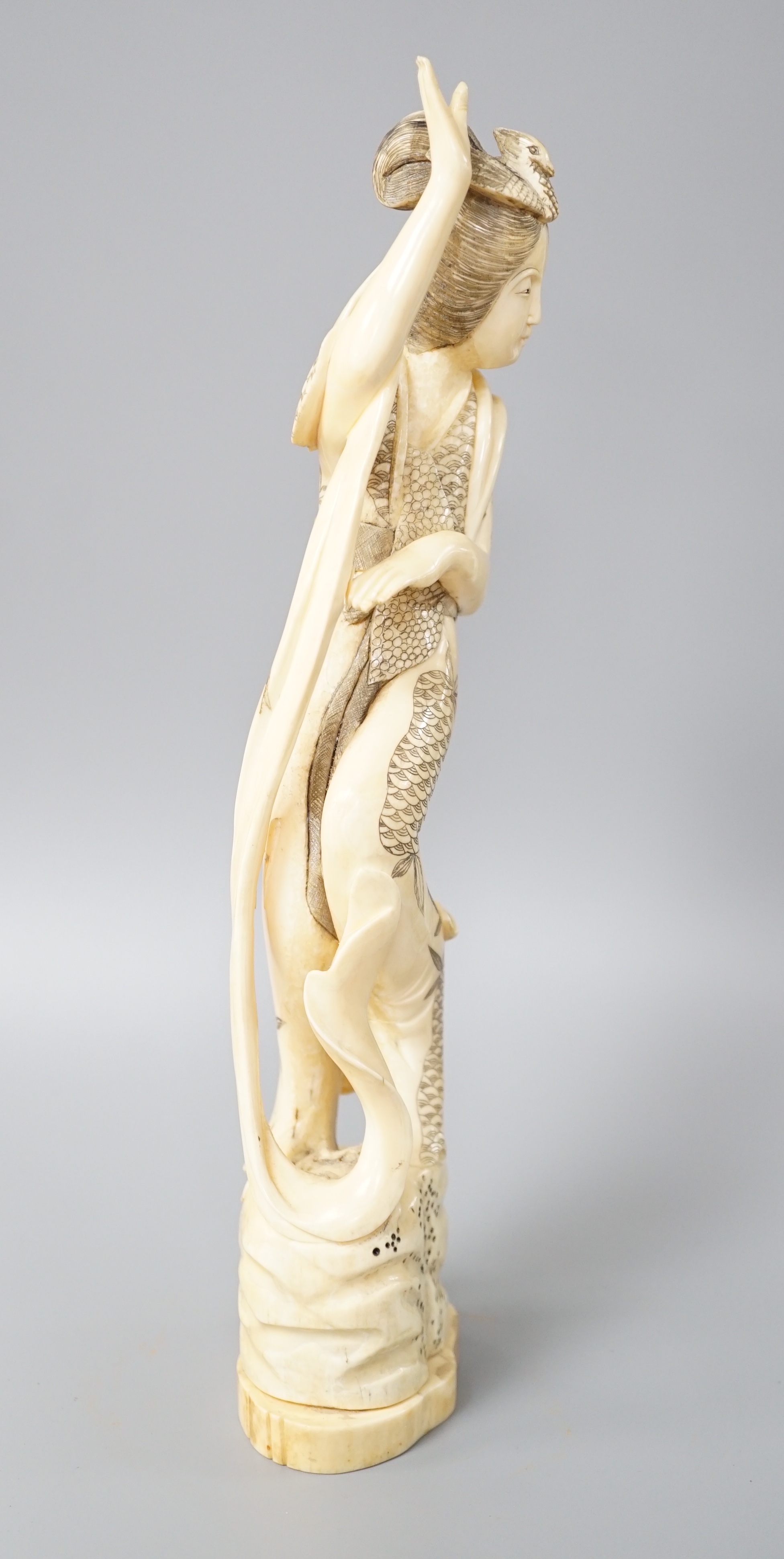 A Japanese walrus ivory figure of Seiobo, the Queen Mother of the West, early 20th century 28cm